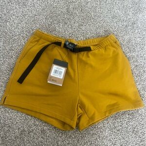 North Face Mustard colored women’s cotton shorts, never worn with tags still on